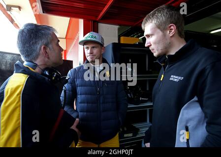 (L to R): Nick Chester (GBR) Renault Sport F1 Team Chassis Technical Director with Nico Hulkenberg (GER) Renault Sport F1 Team and Sergey Sirotkin (RUS) Renault Sport F1 Team Third Driver.  27.02.2017. Formula One Testing, Day One, Barcelona, Spain. Monday.  Photo credit should read: XPB/Press Association Images. Stock Photo
