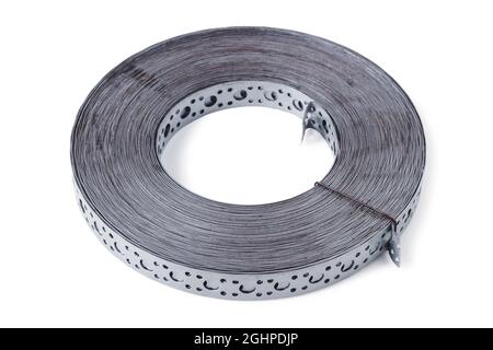 Roll of steel perforated tape isolated on white background Stock Photo