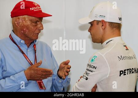 (L to R): Niki Lauda (AUT) Mercedes Non-Executive Chairman with Valtteri Bottas (FIN) Mercedes AMG F1.  07.04.2018. Formula 1 World Championship, Rd 2, Bahrain Grand Prix, Sakhir, Bahrain, Qualifying Day.  Photo credit should read: XPB/Press Association Images. Stock Photo