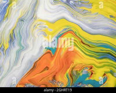 Abstract image of various colors of acrylic paint mixed together using a paint pouring  technique Stock Photo