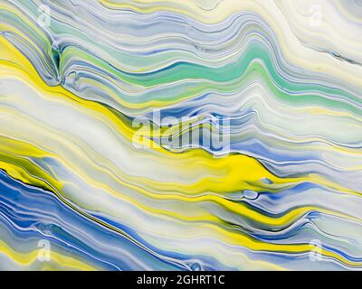 Abstract image of various colors of acrylic paint mixed together using a paint pouring  technique Stock Photo