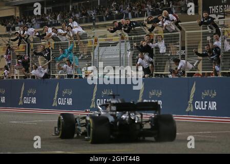 Race winner Lewis Hamilton (GBR) Mercedes AMG F1 W10 as his team celebrate at the end of the race.  31.03.2019. Formula 1 World Championship, Rd 2, Bahrain Grand Prix, Sakhir, Bahrain, Race Day.  Photo credit should read: XPB/Press Association Images. Stock Photo