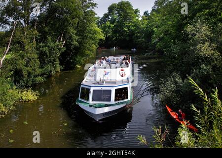 Boat trip on the Wakenitz, Amazon of the North, MS Wakenitz, excursion steamer, border river, Kolonnenweg, Lochplattenweg, inner German border Stock Photo