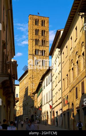 Arezzo Tuscany Italy. A group of people walking down a street next