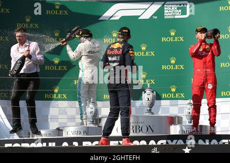 The podium (L to R): James Vowles (GBR) Mercedes AMG F1 Chief Strategist; Lewis Hamilton (GBR) Mercedes AMG F1, race winner; Max Verstappen (NLD) Red Bull Racing, second; Sebastian Vettel (GER) Ferrari, third.  04.08.2019. Formula 1 World Championship, Rd 12, Hungarian Grand Prix, Budapest, Hungary, Race Day.  Photo credit should read: XPB/Press Association Images. Stock Photo