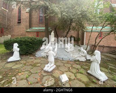 Shrine to 'Our Lady of Fatima Apparition' the 1917 sighting by 3 children in Portugal of the Virgin Mary who spoke to them every week for a month as the story goes. Catholic Church, Brooklyn, New York. Stock Photo