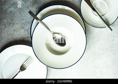 Minimalistic table setting with plate and cutlery Stock Photo