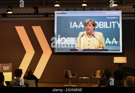 (210907) -- MUNICH, Sept. 7, 2021 (Xinhua) -- German Chancellor Angela Merkel is seen on a screen as she speaks during the opening ceremony of Germany's International Motor Show (IAA) in Munich, Germany, Sept. 7, 2021. IAA, with the slogan 'What will move us next,' kicked off on Tuesday. (Xinhua/Lu Yang) Stock Photo