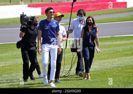 George Russell (GBR) Williams Racing and Lando Norris (GBR) McLaren with Natalie Pinkham (GBR) Sky Sports Presenter on the drivers parade.  18.07.2021. Formula 1 World Championship, Rd 10, British Grand Prix, Silverstone, England, Race Day.  Photo credit should read: XPB/Press Association Images. Stock Photo