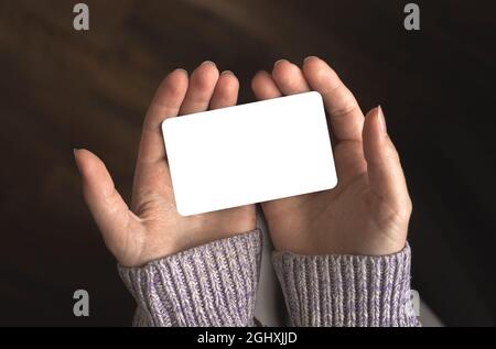 Female hands holding blank card, credit card, business template, copy space Stock Photo
