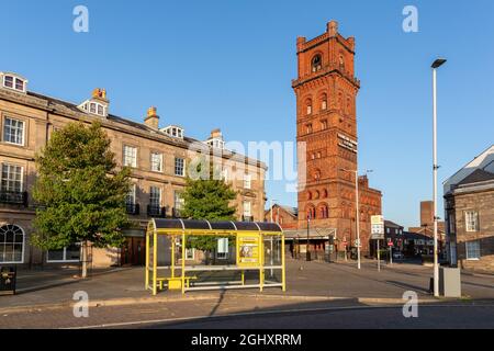 Birkenhead, UK: Bridge Street and Hamilton Square station. The hydraulic tower was used to operate lifts to the underground platform. Stock Photo