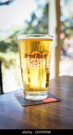 ANGKOR WAT, THAILAND - Jan 05, 2020: A vertical shot of cold Hard Rock Cafe beer on a woody brown table in Angkor Wat, Thailand Stock Photo