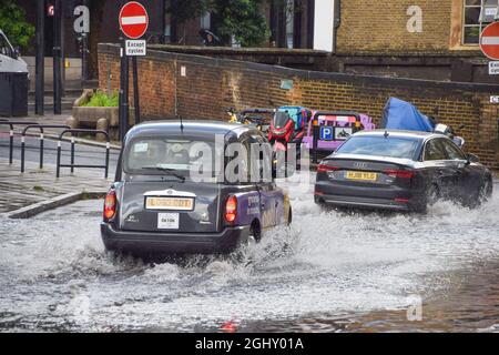 London, UK. 7th August 2021. Flooded Farringdon Lane in central London after a day of heavy rain. Stock Photo