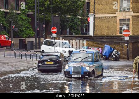 London, UK. 7th August 2021. Flooded Farringdon Lane in central London after a day of heavy rain. Stock Photo