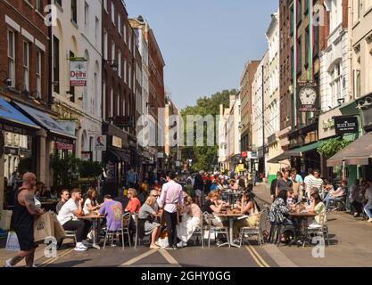 London, United Kingdom. 5th September 2021. Busy Frith Street as al fresco, street seating continues in Soho, Central London. Several streets have been blocked for traffic at certain times of the day and at weekends to allow street seating at bars, cafes and restaurants during the coronavirus pandemic. Stock Photo