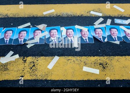 Photos of the President of the People's Republic of China Xi Jinping left by protesters at a crossing near Mong Kok on Nathan Road in Kowloon, Hong Ko Stock Photo