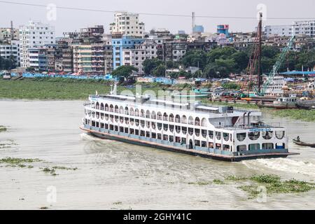 Dhaka, Bangladesh : The Buriganga river is always busy with wooden boats and passenger ferries Stock Photo