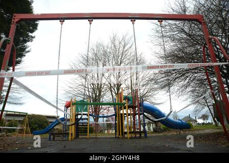 REEFTON, NEW ZEALAND, SEPTEMBER 6, 2021: Signage and barriers warn children away from a public playground during the Covid 19 lockdown in New Zealand, September 6,  2021 Stock Photo