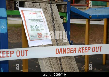 REEFTON, NEW ZEALAND, SEPTEMBER 6, 2021: Signage and barriers warn children away from a public playground during the Covid 19 lockdown in New Zealand, September 6,  2021 Stock Photo