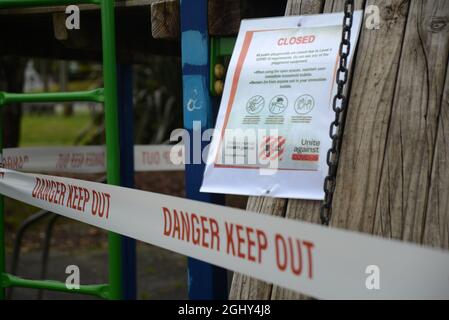 REEFTON, NEW ZEALAND, SEPTEMBER 6, 2021: Signage and barriers warn children away from a public playground during the Covid 19 lockdown in New Zealand, September 6,  2021 Stock Photo