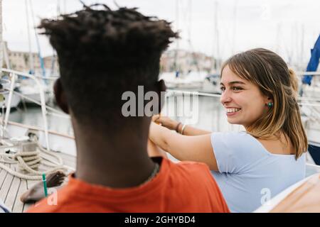 Multicultural millennial friends laughing and having fun outdoors  Stock Photo
