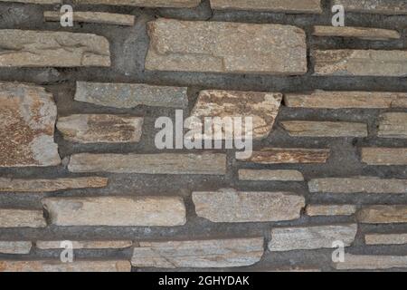 rustic wall made with rough stone bricks Stock Photo