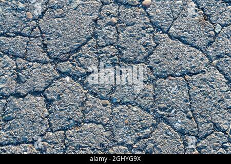 texture of cracked old asphalt, background of old asphalt road or sidewalk Stock Photo