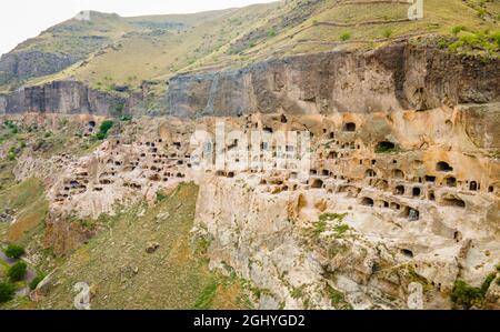 Aerial view of Vardzia ancient cave monastery in the Erusheti Mountain at Kura River in Georgia from the side in summer Stock Photo