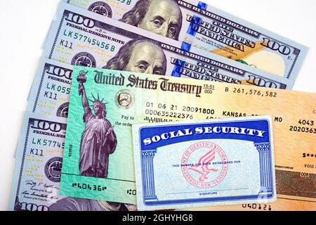 US Government Stimulus Check with Social Security card Stock Photo