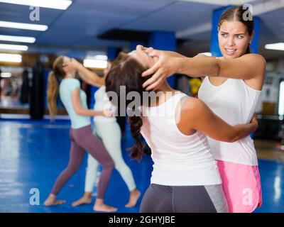 Woman training eye-gouging movement Stock Photo