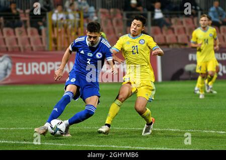 Zenica, Bosnia and Herzegovina (BiH). 7th Sep, 2021. Dennis Hadzikadunic (L front) of Bosnia and Herzegovina competes against Georgi Zhukov of Kazakhstan during the FIFA World Cup Qualifier match between Bosnia and Herzegovina (BiH) and Kazakhstan in Zenica, Bosnia and Herzegovina (BiH), Sep. 7, 2021. Credit: Nedim Grabovica/Xinhua/Alamy Live News Stock Photo