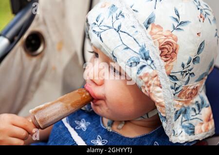 Umea, Norrland Sweden - July 27, 2021: eating ice cream that tastes like cola Stock Photo