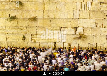 Jerusalem, Israel - August 31, 2021: Crowd of Jewish prayers attend a mass Selichot, Jewish penitential prays, at the Western Wall, Old City of Jerusa Stock Photo