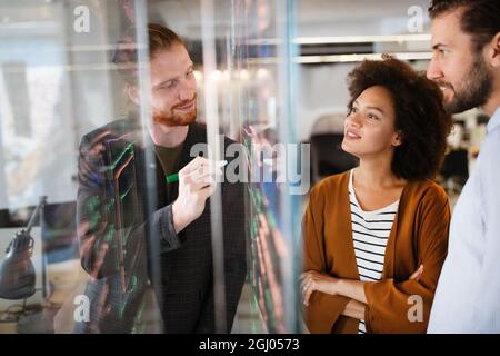 Group of business people collaborating on project in office Stock Photo