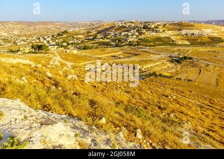 View towards the lower Herodium, the Judaean desert and Palestinian villages. The West Bank, South of Jerusalem Stock Photo