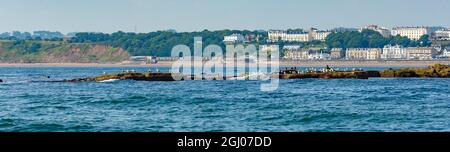 10 July 2021, Filey, North Yorkshire, UK. Filey Brigg, North Yorkshire, UK.  Panoramic view of Filey Brigg, a traditional seaside resort,  and the ele Stock Photo