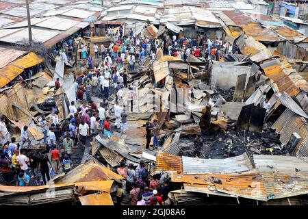 Non Exclusive: DHAKA CITY, BANGLADESH - SEPTEMBER 6: Persons are seen after the fire that broke out at Keraniganj's Noor Super Market last night. At l Stock Photo