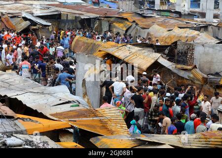 Non Exclusive: DHAKA CITY, BANGLADESH - SEPTEMBER 6: Persons are seen after the fire that broke out at Keraniganj's Noor Super Market last night. At l Stock Photo