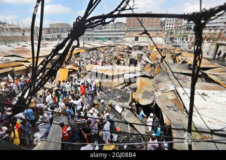 Non Exclusive: DHAKA CITY, BANGLADESH - SEPTEMBER 6: Persons are seen after the fire that broke out at Keraniganj's Noor Super Market last night. At l Stock Photo