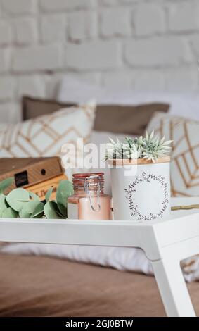 Books on a wooden table with a cup of coffee next to it. Working from home during coronavirus pandemic. modern workflow. Stock Photo