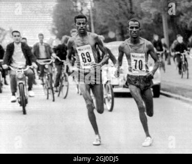 Ethiopia's champion marathon runner crosses the finish line in Stockholm, Sweden to set a new world record for the one hour run. He covered 20.226 meters in the time. The old record of 20.052.5 meters belonged to veteran World Champion Emil Zatopek. 28th May 1962. Stock Photo