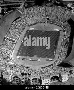 An aerial view of the impressive scene at Wembley during the preliminaries of the opening ceremonies of the Olympic Games.The vast stadium is packed with over 80,000 people as the athletes file on to the green-swarded arena. 29th July 1948. Stock Photo