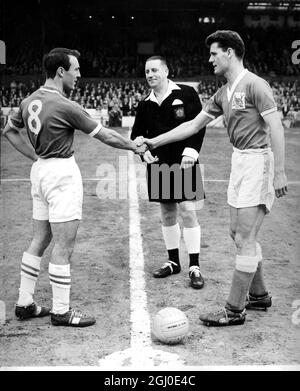 Chelsea v Nottingham Forest Jimmy Greaves, Chelsea inside right and captain for his last game with Chelsea shakes hands with the Forest skipper McKinlay. Greaves scored all four of the Chelsea goals in this match. 29th April 1961. Stock Photo