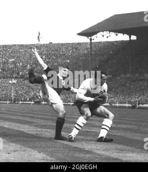 England v Scotland England goalkeeper Ron Springett of Sheffield Wednesday, collides with Scotland's outside left Davie Wilson of Glasgow Rangers during the International match at Wembley Stadium. 15th April 1961. Stock Photo