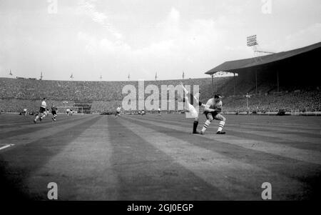 England v Scotland England goalkeeper Ron Springett of Sheffield Wednesday, collides with Scotland's outside left Davie Wilson of Glasgow Rangers during the International match at Wembley Stadium. 15th April 1961. Stock Photo