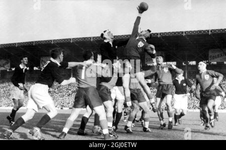 The French forward Mias (centre) gets up to the ball before Scotland's Swan as other players surround them. France beat Scotland by nine points to nil in their first rugby match for the Five Nations trophy at the Colombes stadium in Paris. 10th January 1959. Stock Photo