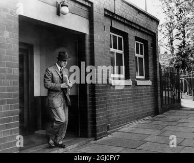 Stan Cullis is seen leaving the Molineux ground for the last time after he was sacked as the Wolverhampton Wanderers manager. 19th September 1964 Stock Photo