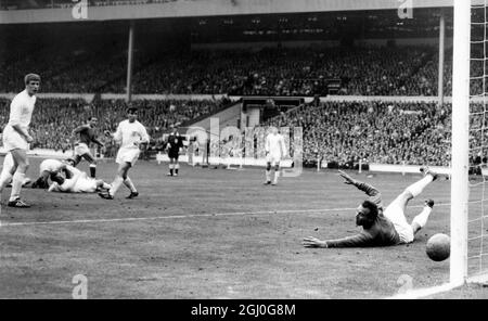 1966 FA Cup Final Everton v Sheffield Wednesday. 21-years old, Mike Trebilcock (dark shirt), the Everton inside-right has four Sheffield defenders and goalkeeper, Ron Springett defeated, as he scores his team's second goal at Wembley. 14th May 1966 Stock Photo