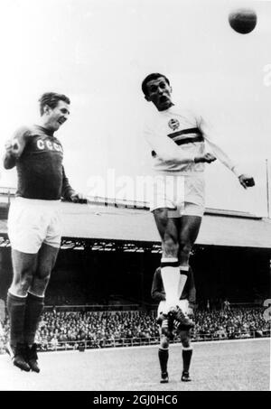 Russia's Vasily Danilov and Hungary's Lorian Albert both leap in a heading duel during their World Cup quarter final match, July 23 1966 Stock Photo