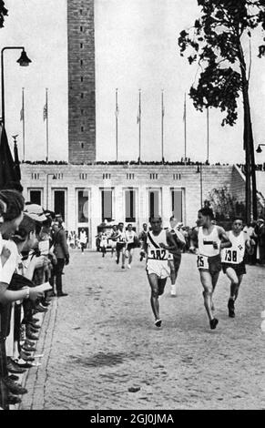 1936 Olympics, Berlin - Kitei Son (left) (Japan), Marathon winner, drawing smoothly away from the pack at the start with the first three runners ..... ©TopFoto Stock Photo